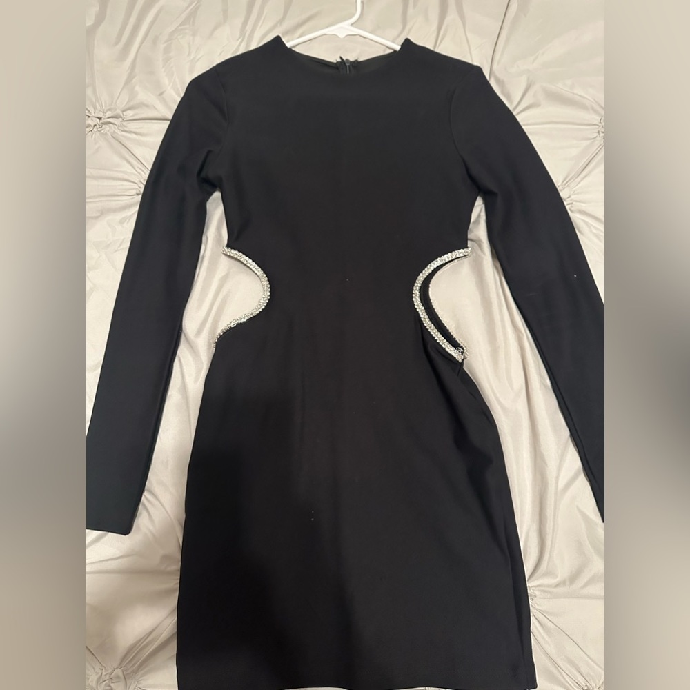 Black dress with cut out sides lined with rhinestones